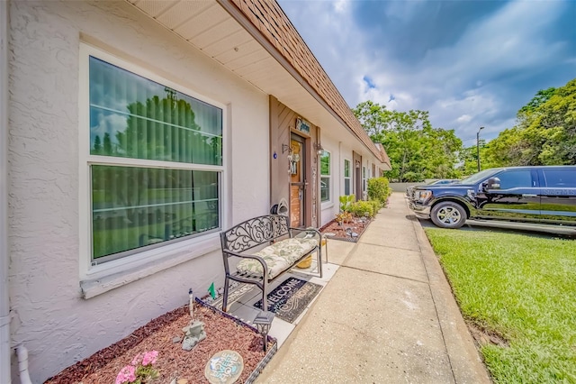 view of side of property with a lawn