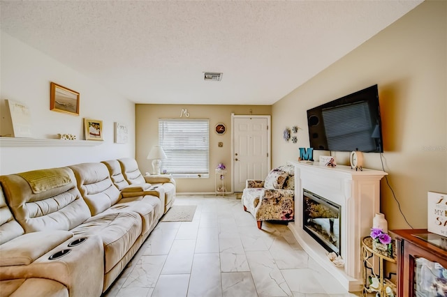 living room with a textured ceiling