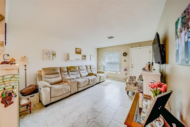 living room with a textured ceiling