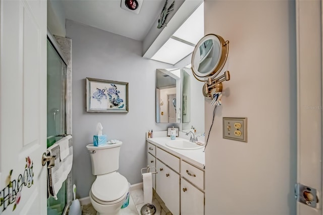 bathroom with tile patterned flooring, vanity, toilet, and a shower with door