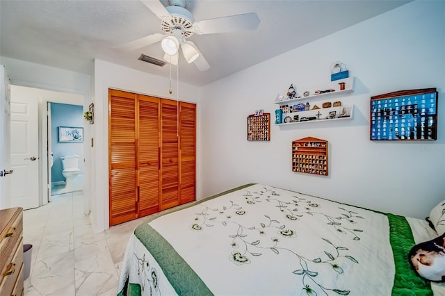 bedroom featuring ceiling fan and a closet