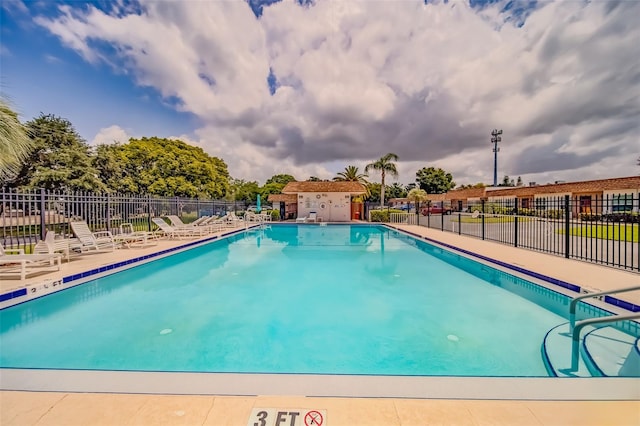 view of swimming pool with a patio