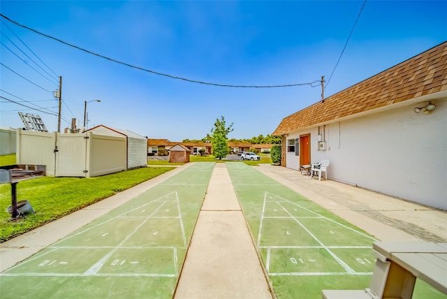 view of property's community with a lawn