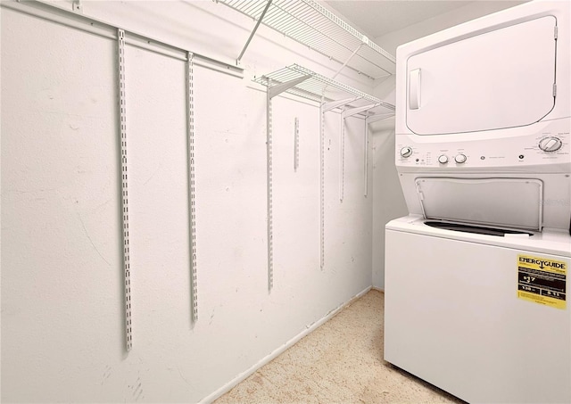 washroom with stacked washer and dryer