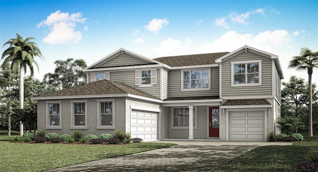 view of front of home with a front yard and a garage