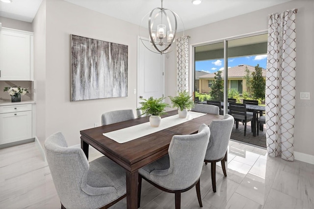 dining space with an inviting chandelier