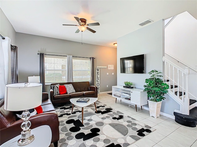 tiled living room featuring ceiling fan