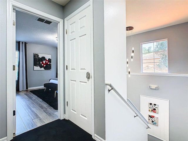 corridor with dark wood-type flooring