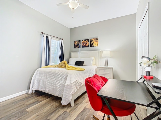 bedroom with ceiling fan and light hardwood / wood-style flooring