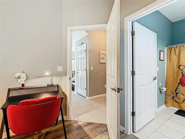 hallway with light tile patterned floors