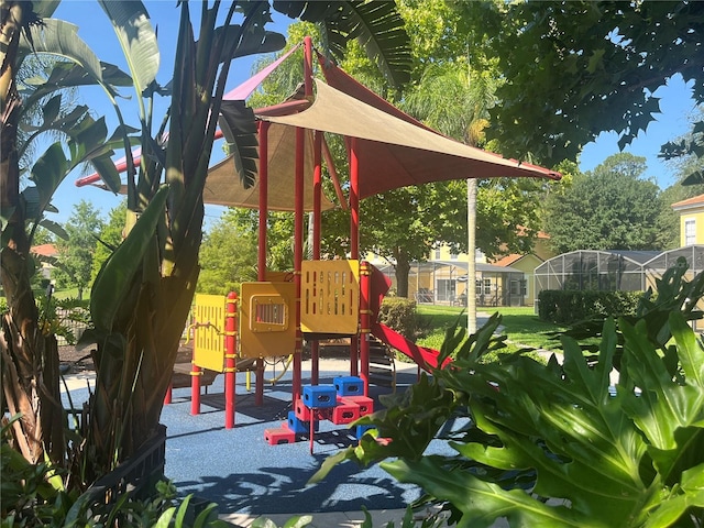 view of jungle gym with a lawn