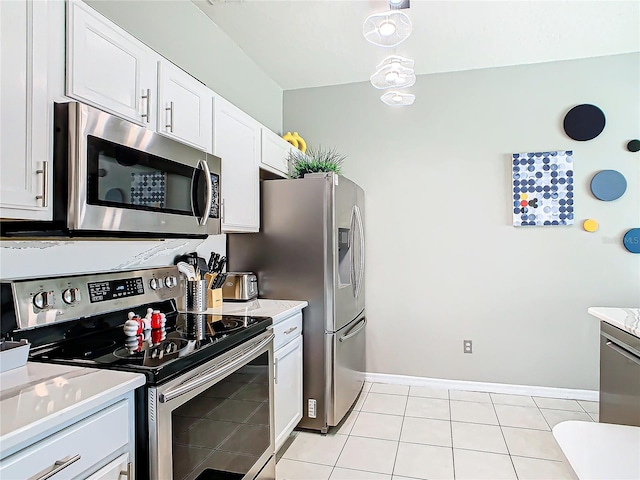 kitchen with light tile patterned floors, white cabinetry, and appliances with stainless steel finishes