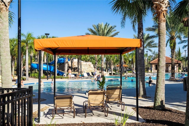 view of pool with a water slide and a gazebo