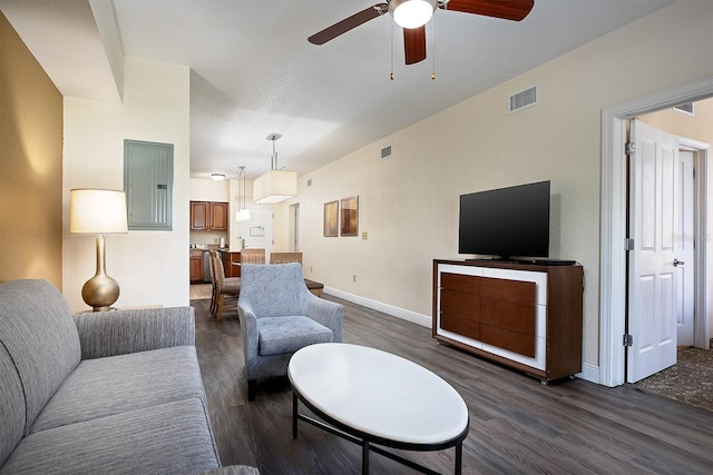 living room featuring ceiling fan, dark wood-type flooring, and electric panel