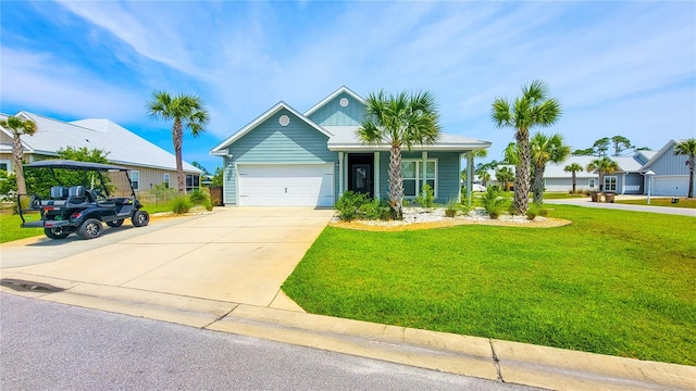 view of front of home with a garage and a front yard