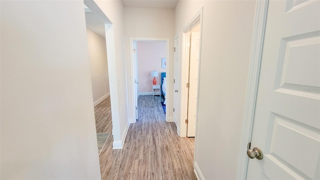 corridor featuring light hardwood / wood-style flooring