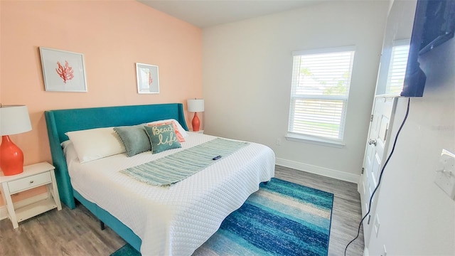 bedroom with wood-type flooring