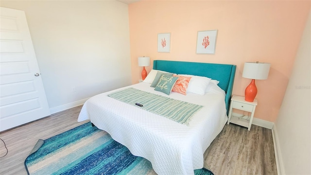 bedroom featuring wood-type flooring