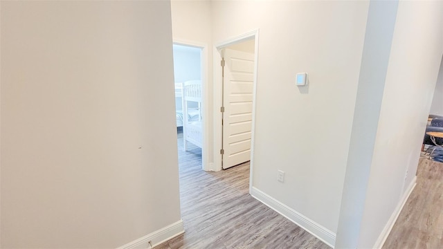 corridor featuring light hardwood / wood-style flooring