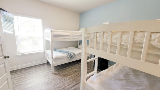 bedroom with hardwood / wood-style flooring