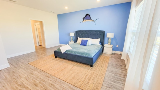 bedroom with wood-type flooring