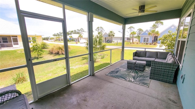 sunroom with plenty of natural light and ceiling fan