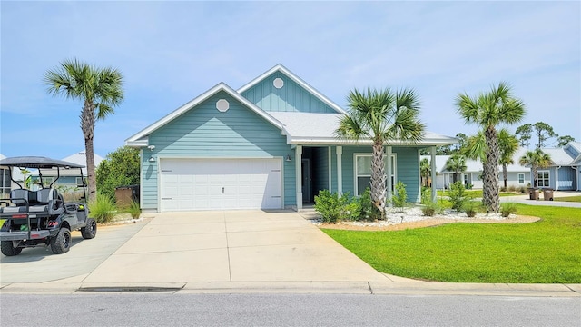 view of front of property with a garage and a front lawn