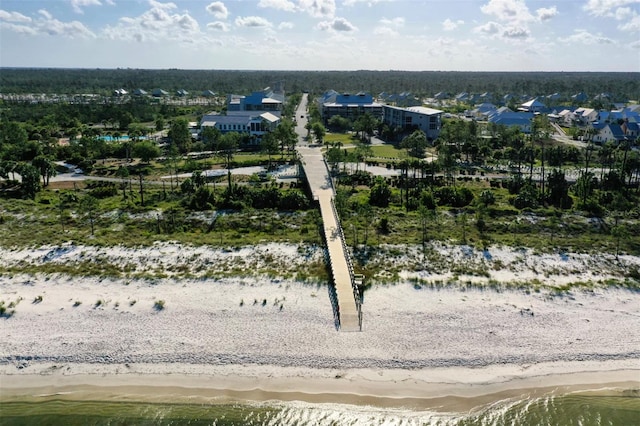 drone / aerial view with a beach view and a water view