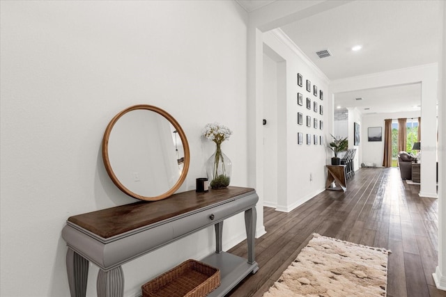 hall featuring dark hardwood / wood-style floors and ornamental molding