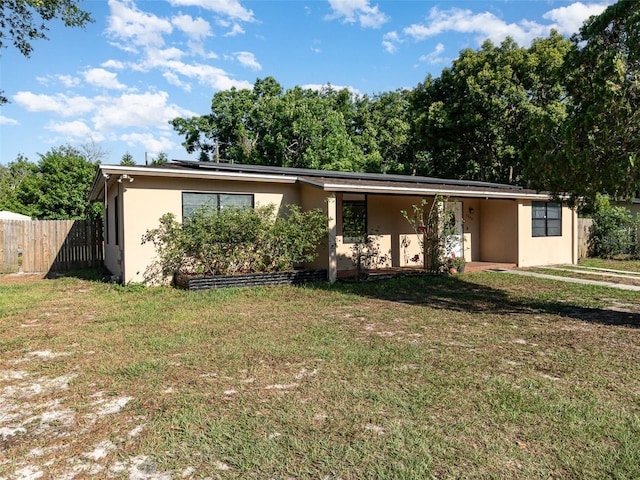 single story home featuring a front yard