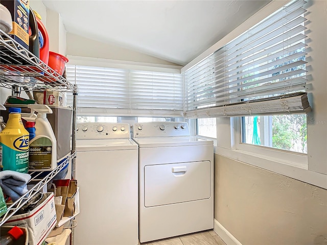 washroom with washing machine and clothes dryer