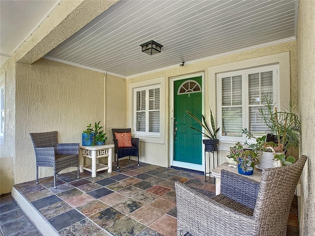 entrance to property with a patio area