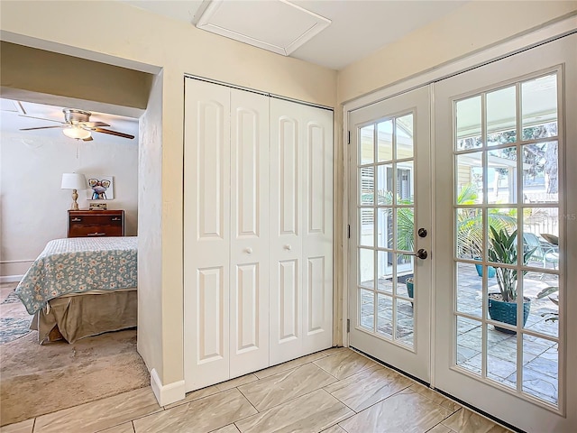 doorway featuring french doors and ceiling fan