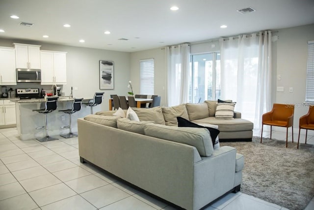 living room with light tile floors