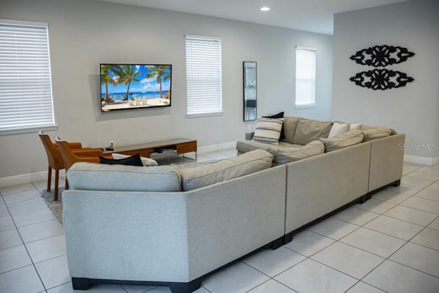 living room featuring plenty of natural light and light tile floors