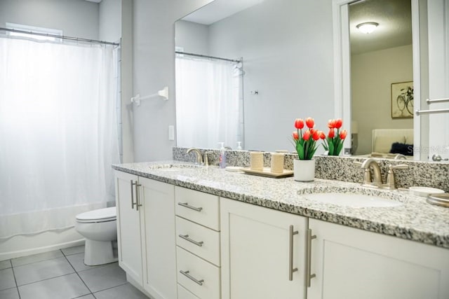 full bathroom featuring dual bowl vanity, tile flooring, shower / bath combination with curtain, and toilet