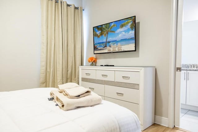 bedroom with light hardwood / wood-style flooring