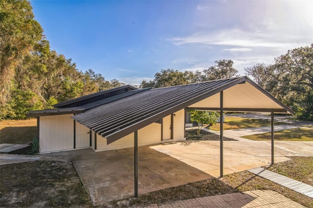 view of parking / parking lot with a carport