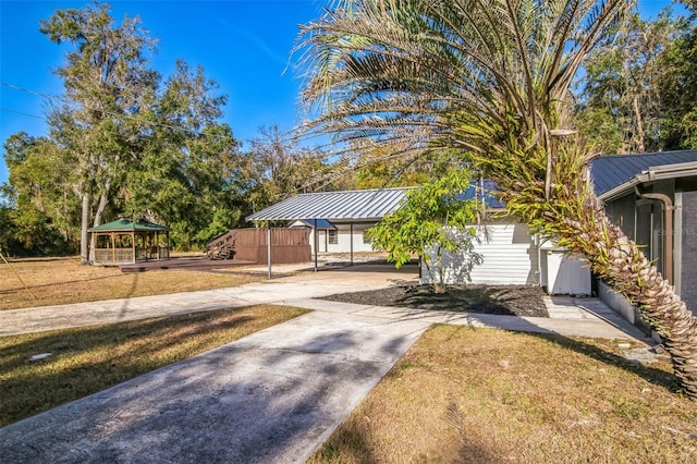 view of community featuring a gazebo and a yard