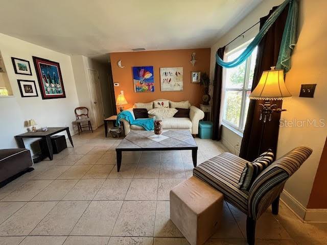 living room with light tile patterned floors