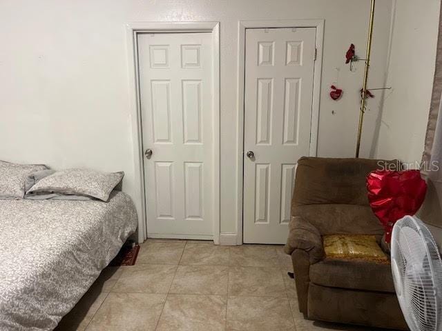 7313 Cabor Ct, Orlando, FL 32818 - bedroom with light tile patterned floors