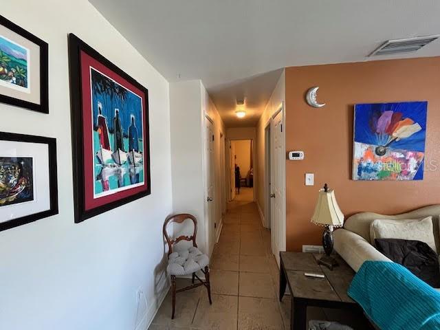 hallway featuring light tile patterned floors