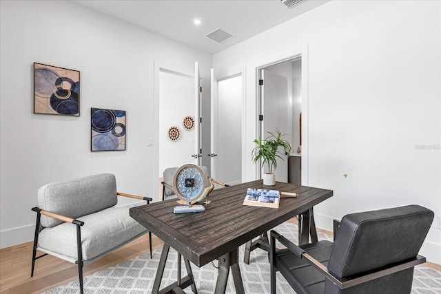 office area with hardwood / wood-style flooring