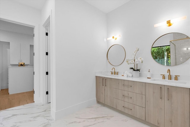 bathroom with hardwood / wood-style floors and double sink vanity