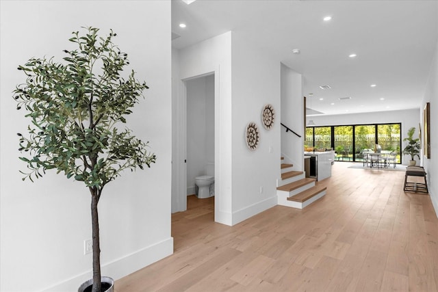 hall with light hardwood / wood-style floors