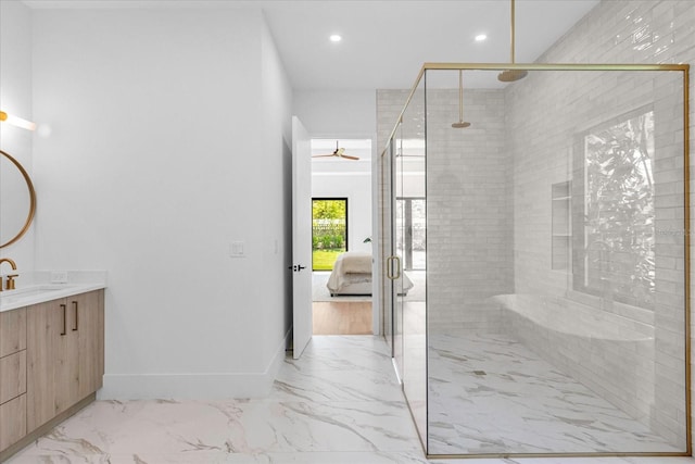 bathroom featuring a shower with shower door, wood-type flooring, vanity, and ceiling fan