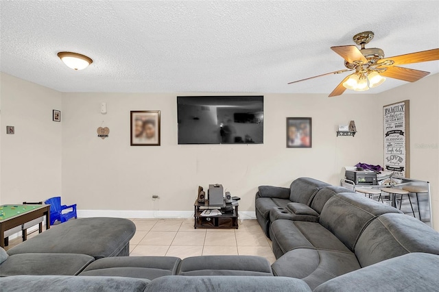 tiled living room with a textured ceiling and ceiling fan