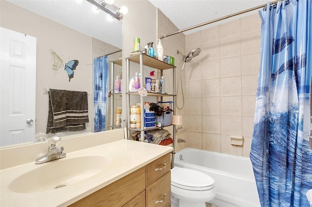 full bathroom with a textured ceiling, toilet, shower / bath combo with shower curtain, and vanity