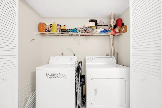 clothes washing area with washer and clothes dryer and electric dryer hookup