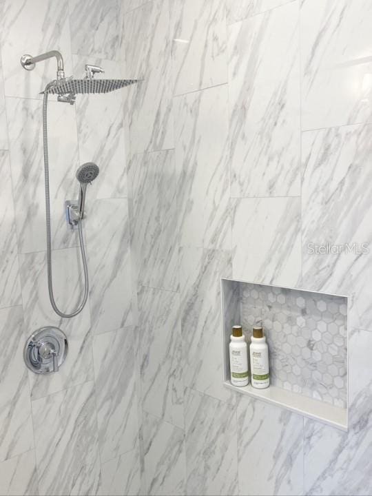 room details with a tile shower